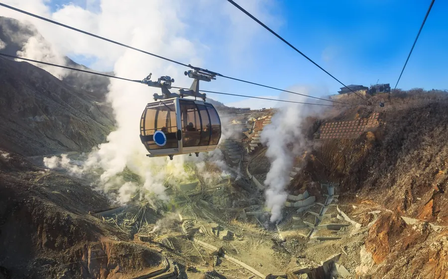 A ropeway cabin crossing the steaming Owakudani valley